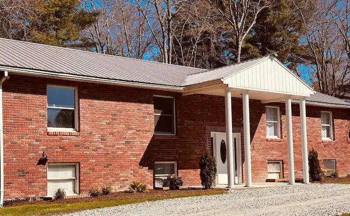 Exterior of Serenity Woods Sanctuary brick home